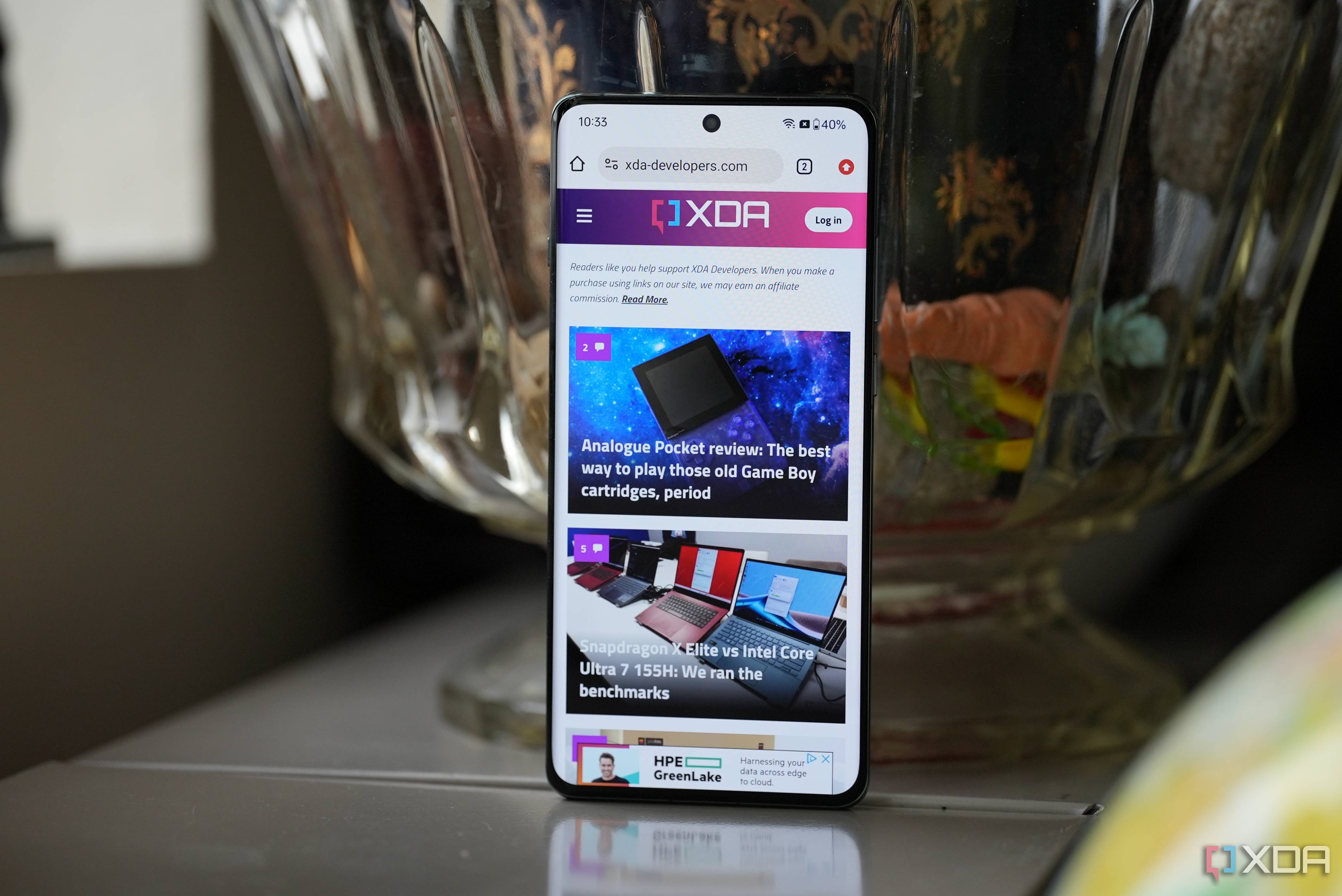 The display on the OnePlus 12 showing the XDA homepage.