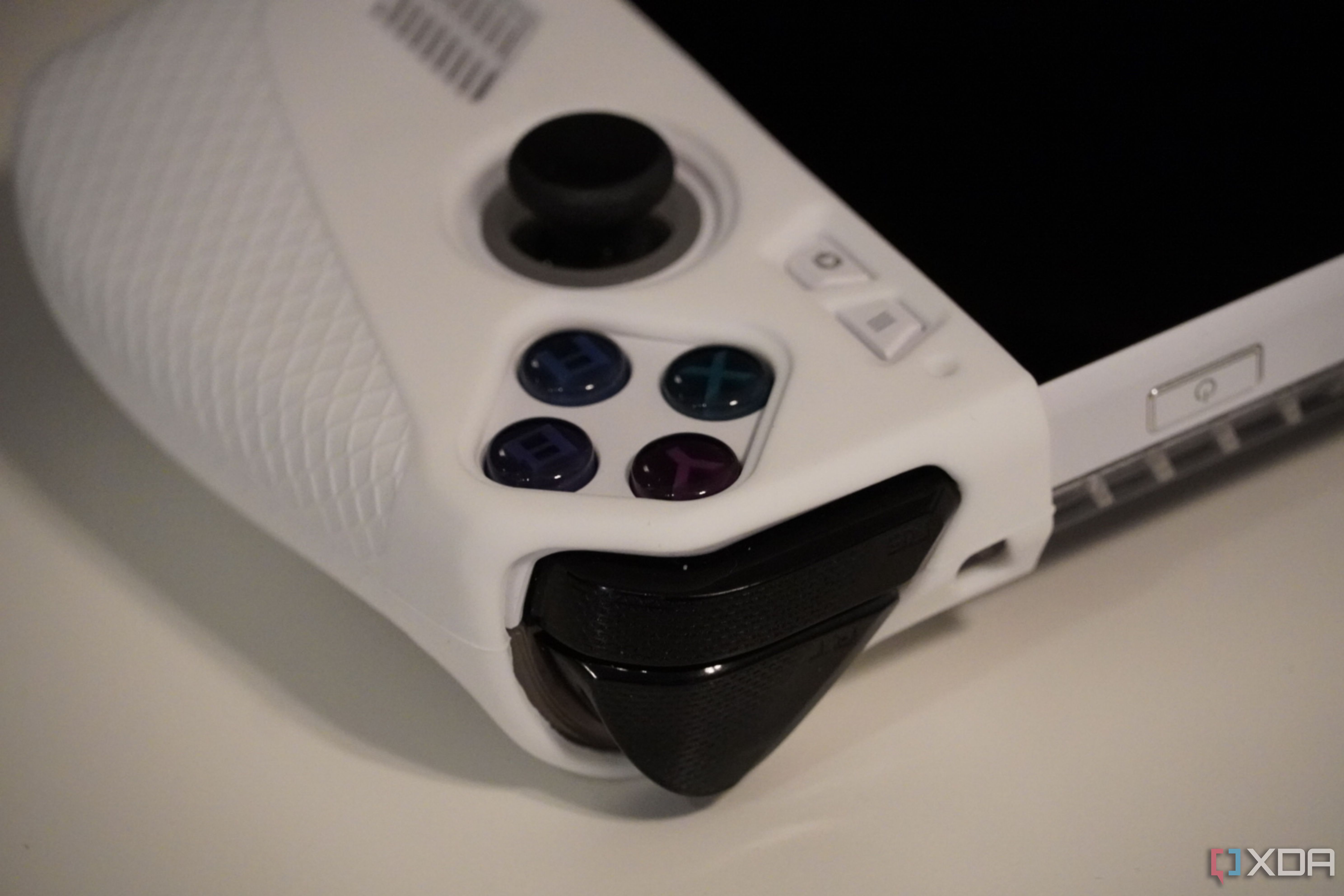 The cutouts for the joystick and XYAB buttons on the Jsaux Grip Set.