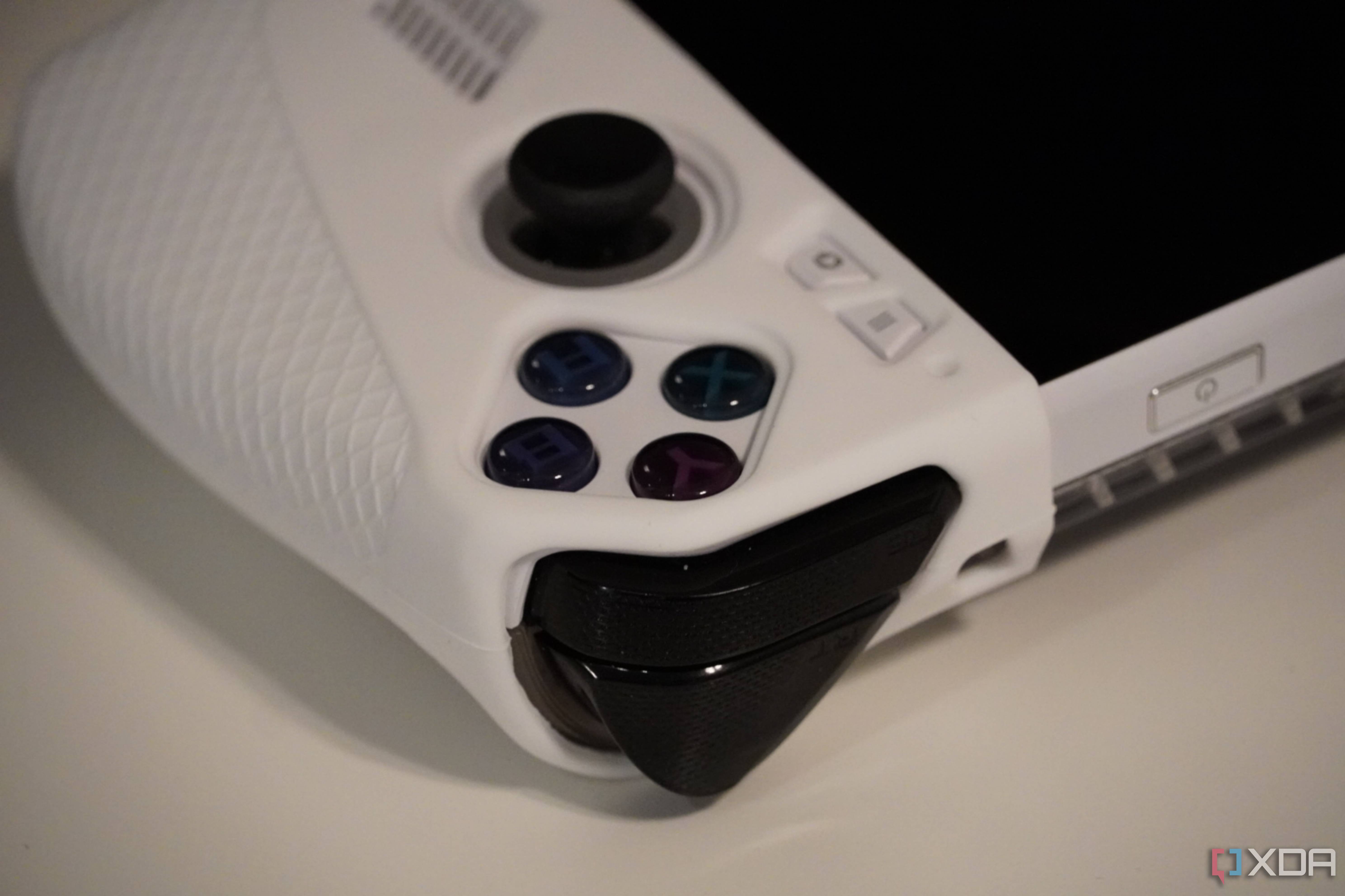 The cutouts for the joystick and XYAB buttons on the Jsaux Grip Set.