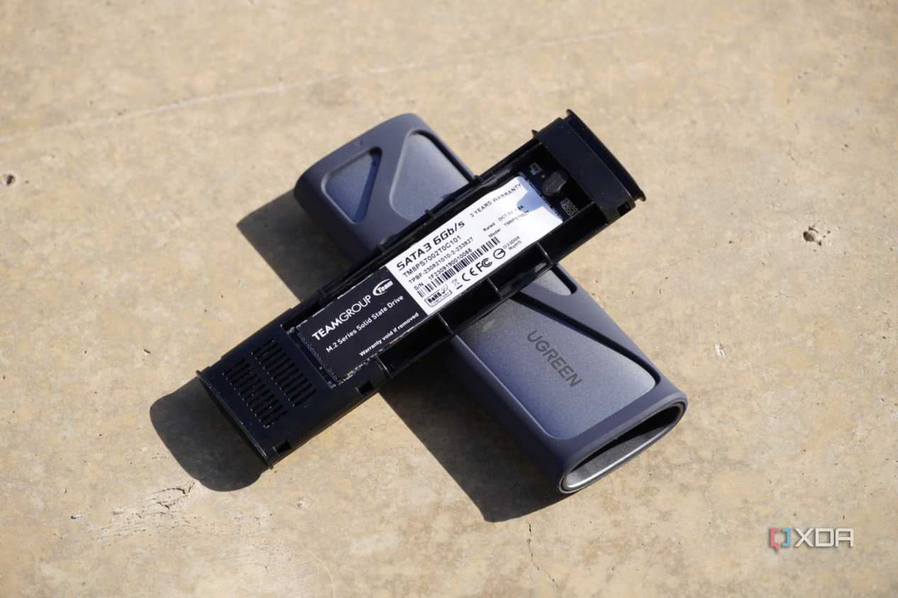 The UGreen SSD enclosure opened up on the ground
