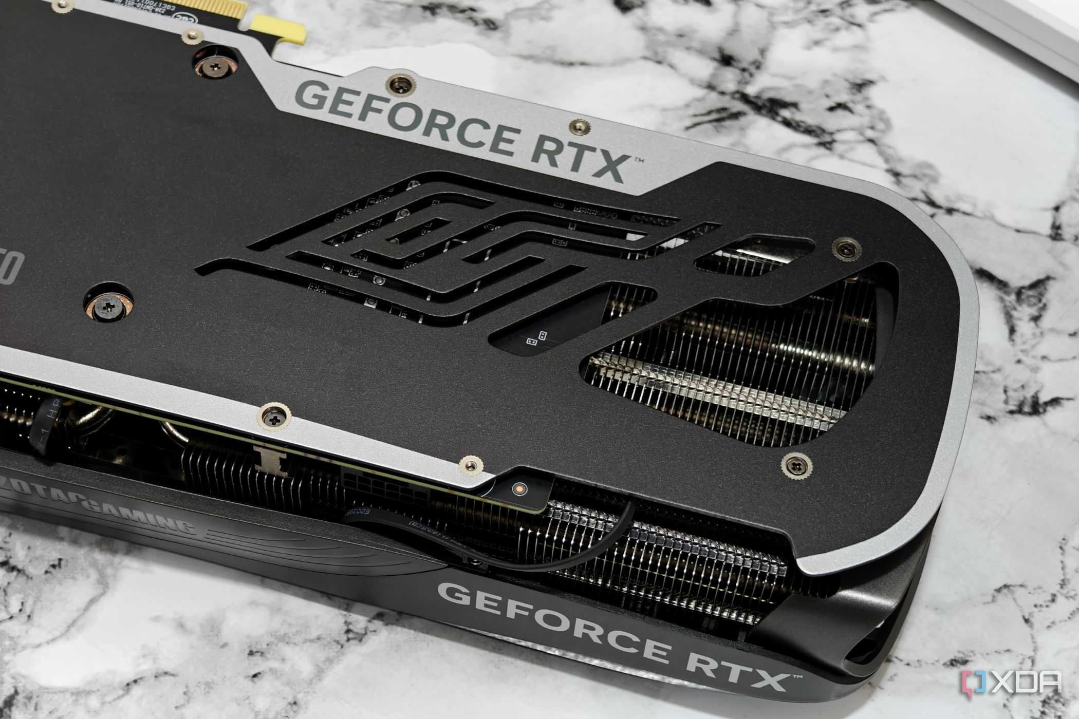 An image showing a Zotac Gaming GeForce RTX 4070 Super Trinity Black Edition GPU's backplate and heatsink.