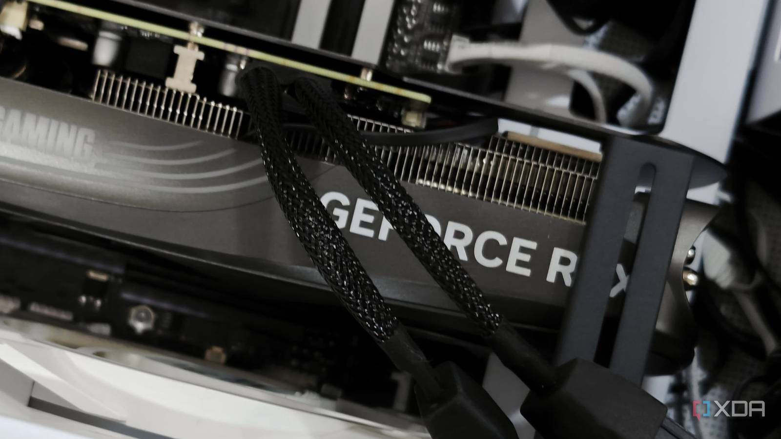 An image showing a Zotac Gaming GeForce RTX 4070 Super Trinity Black Edition GPU installed on a computer.power.