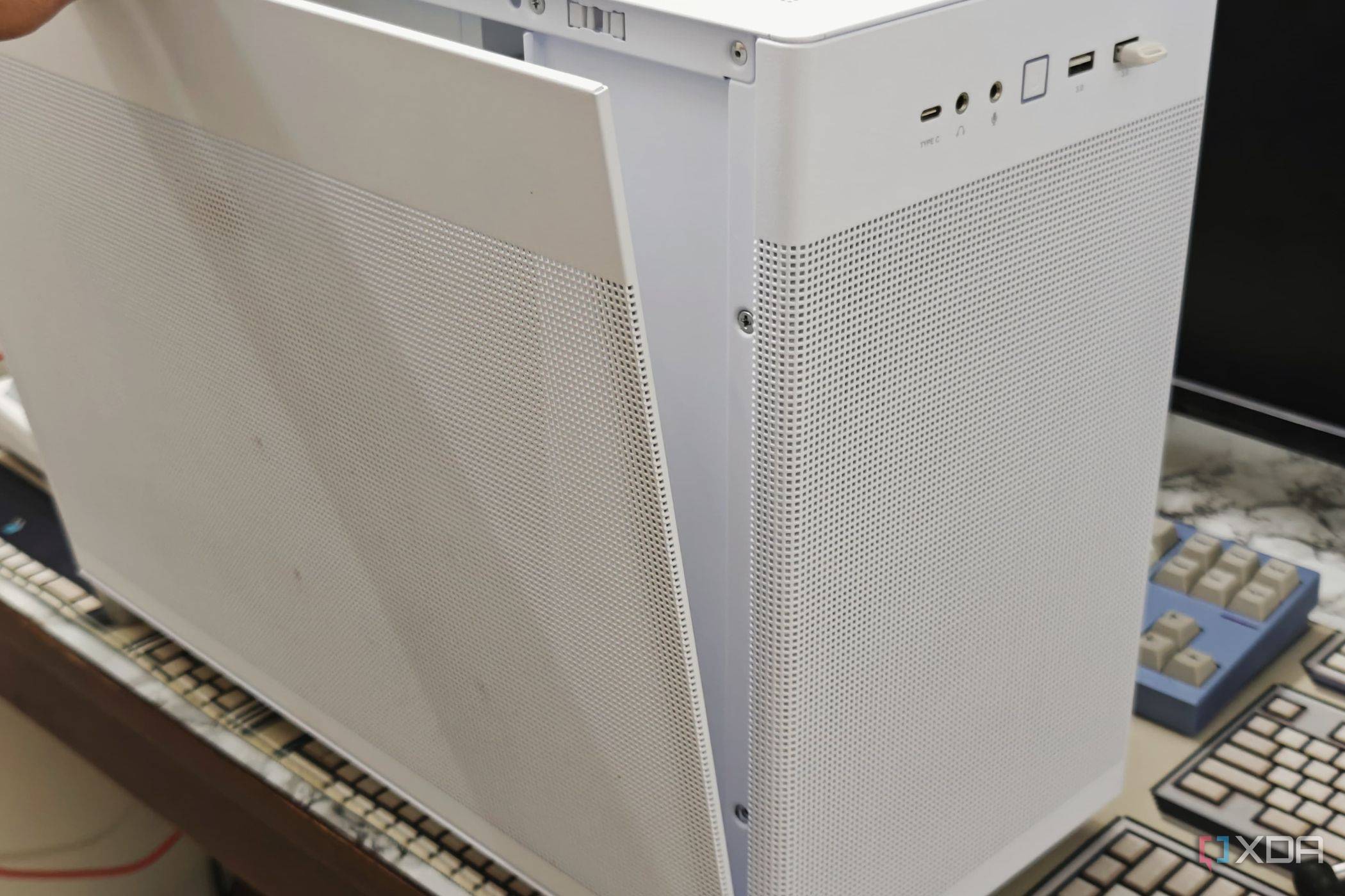 An image showing the side panel being installed on the pc case.