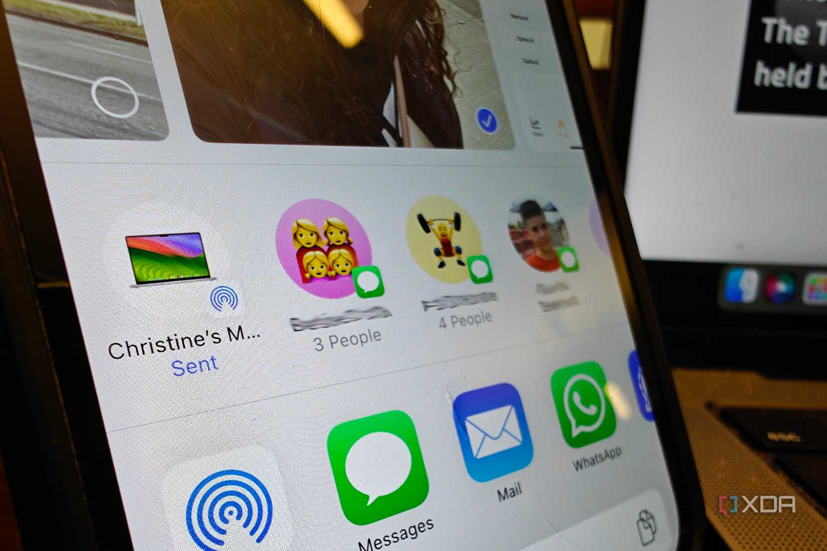 A close up of iPhone AirDrop menu showing sent.