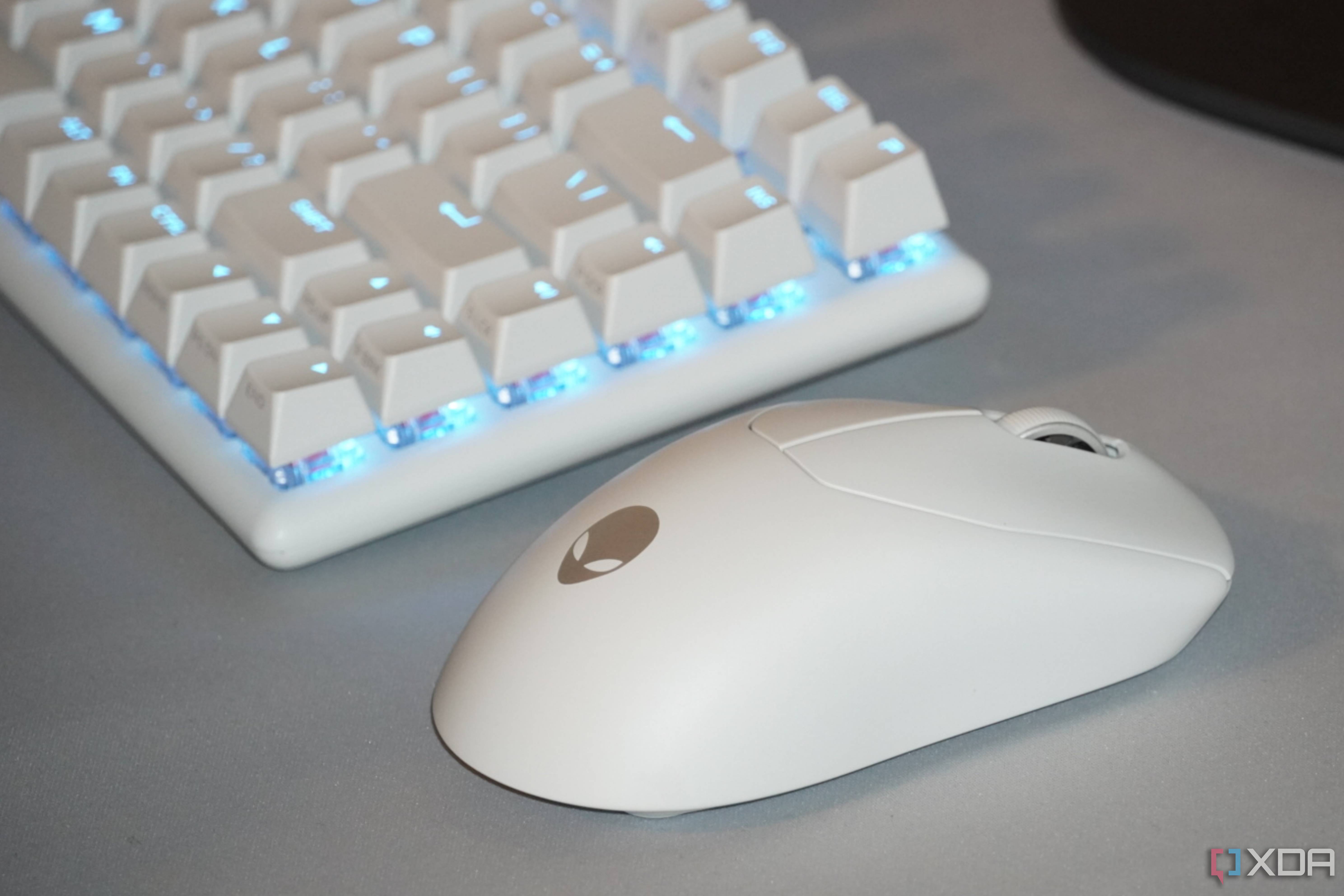 An Alienware Pro Gaming Mouse as part of a desk setup.