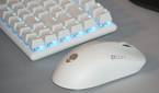 An Alienware Pro Gaming Mouse as part of a desk setup.