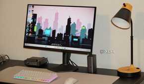 The Alienware QD-OLED 27 monitor as part of a desk setup.
