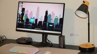 The Alienware QD-OLED 27 monitor as part of a desk setup.
