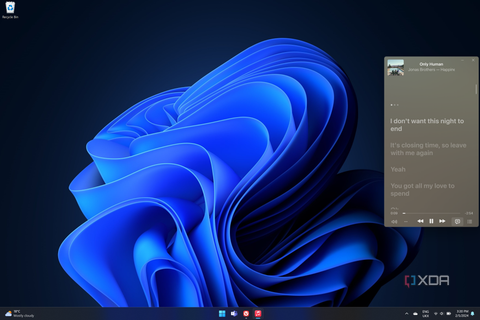 Screenshot of a Windows 11 desktop displaying the Apple Music mini player