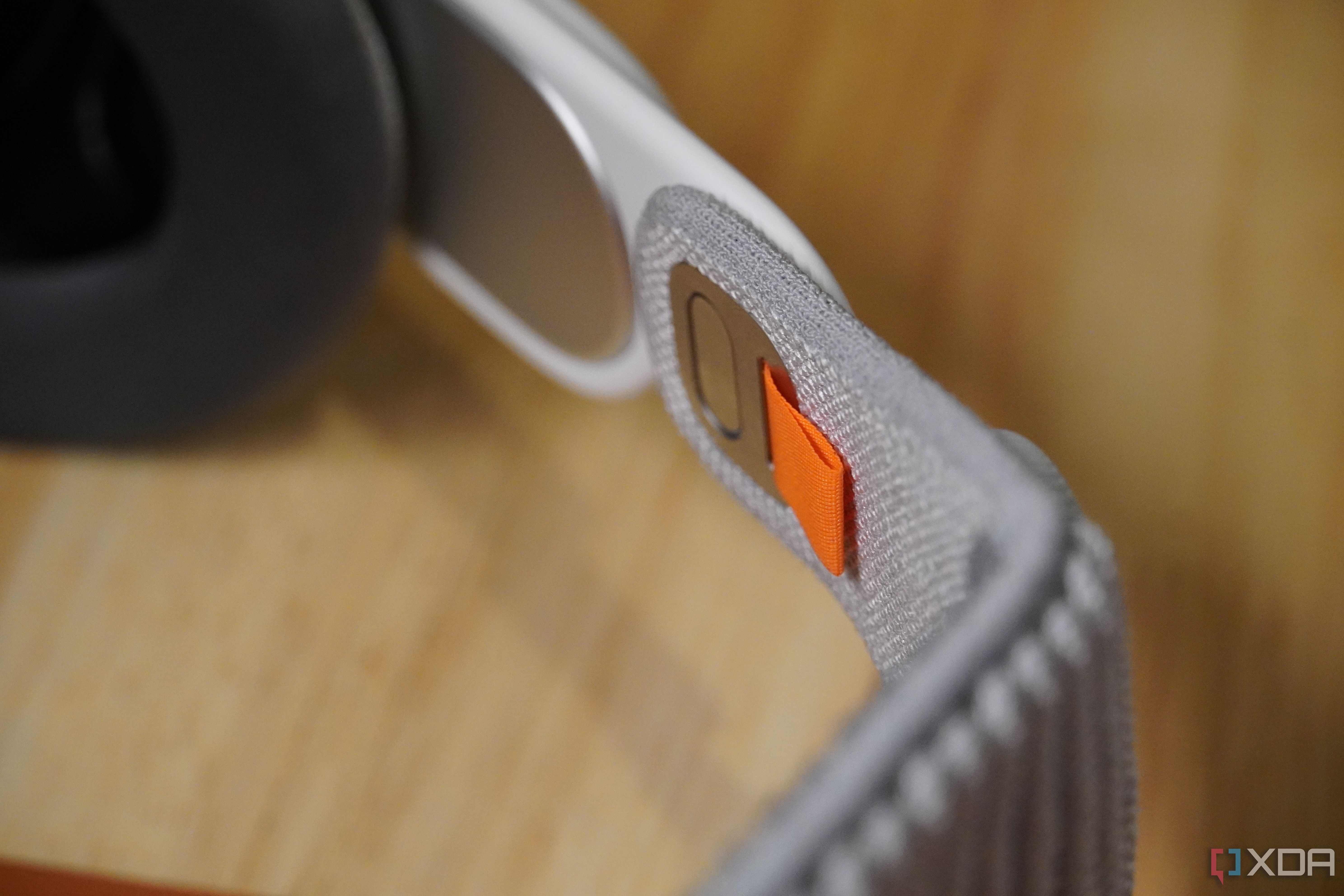 The strap attachment mechanism on Apple Vision Pro.