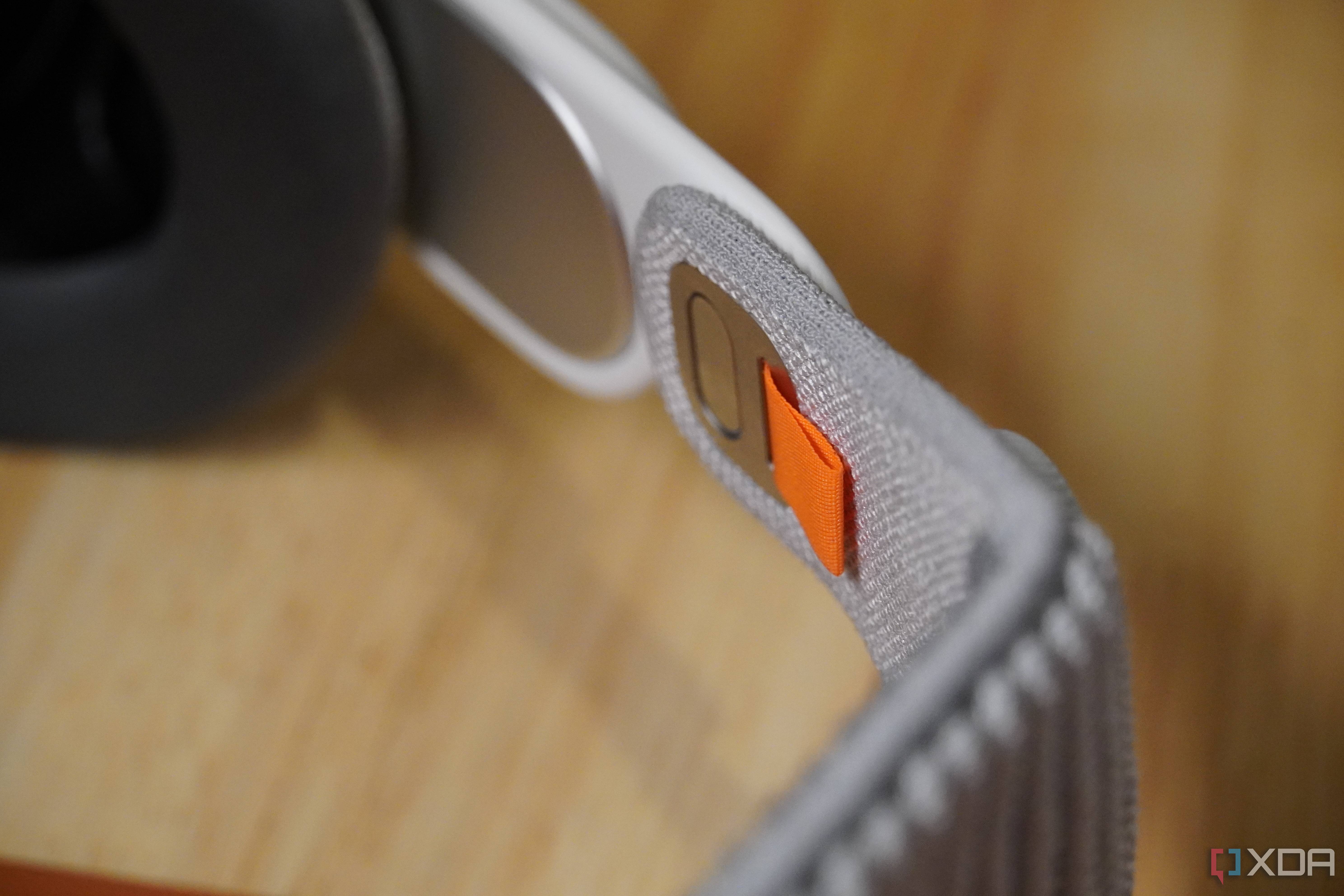 The strap attachment mechanism on Apple Vision Pro.