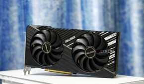 An image showing the ASRock Challenger RX 7700 XT 12G OC GPU kept on a white-colored PC case.