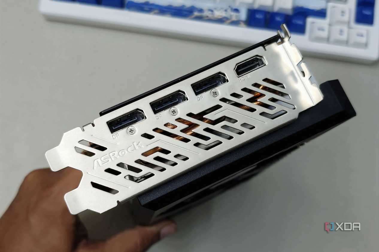 An image showing the IO shroud and ports of the ASRock RX 7700 XT GPU.