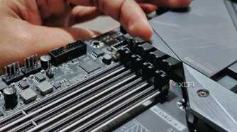 An image showing a person undoing the latches securing the ram modules on the slot.