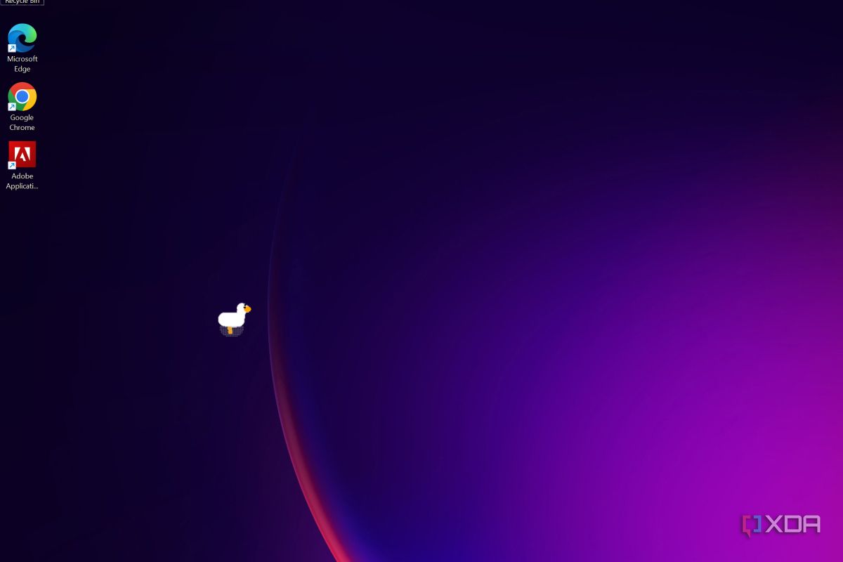Windows 11 desktop with the goose running across the screen