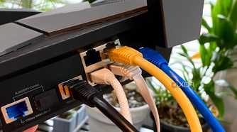 Ethernet cables of various types plugged into a TP-Link Archer AXE300