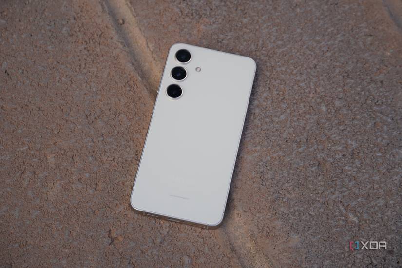 The Samsung Galaxy S24 face down on a ledge.