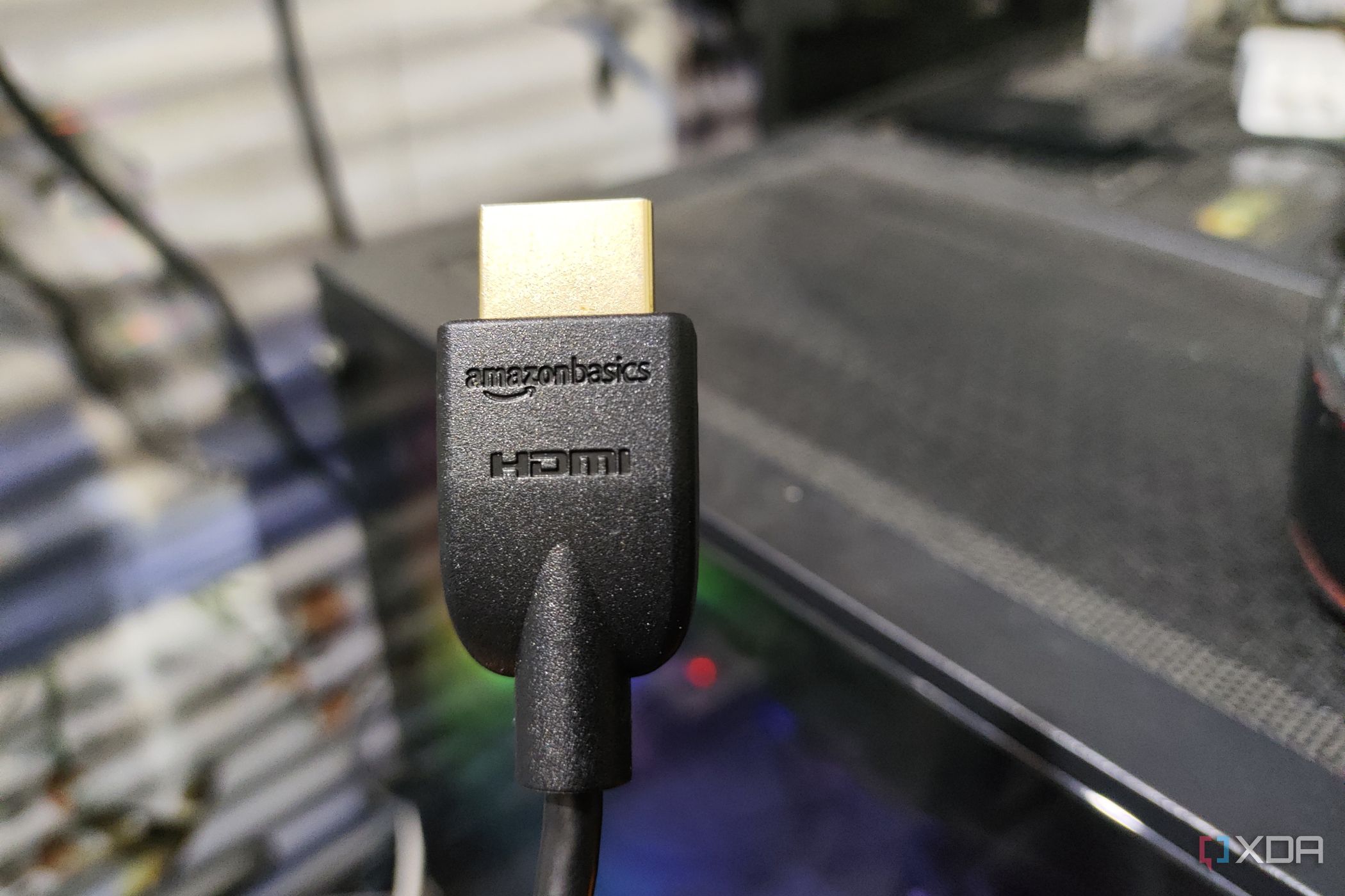 An HDMI cable held in front of a PC 