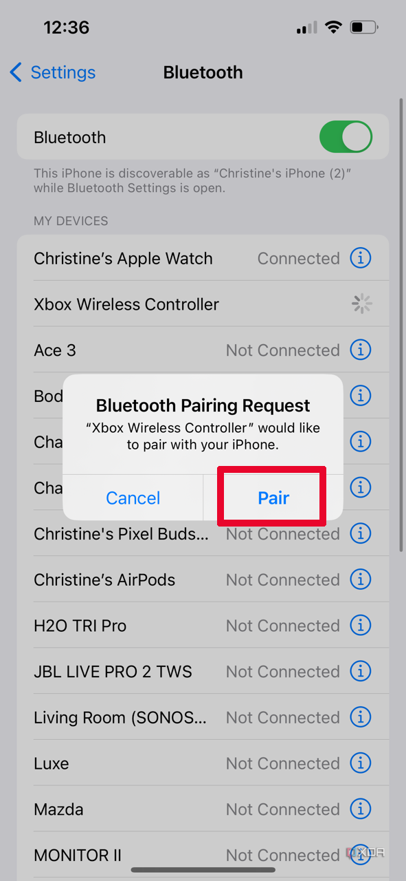 A pop-up Bluetooth Pairing Request in the Bluetooth menu on iPhone with Pair selected.