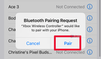 A pop-up Bluetooth Pairing Request in the Bluetooth menu on iPhone with Pair selected.