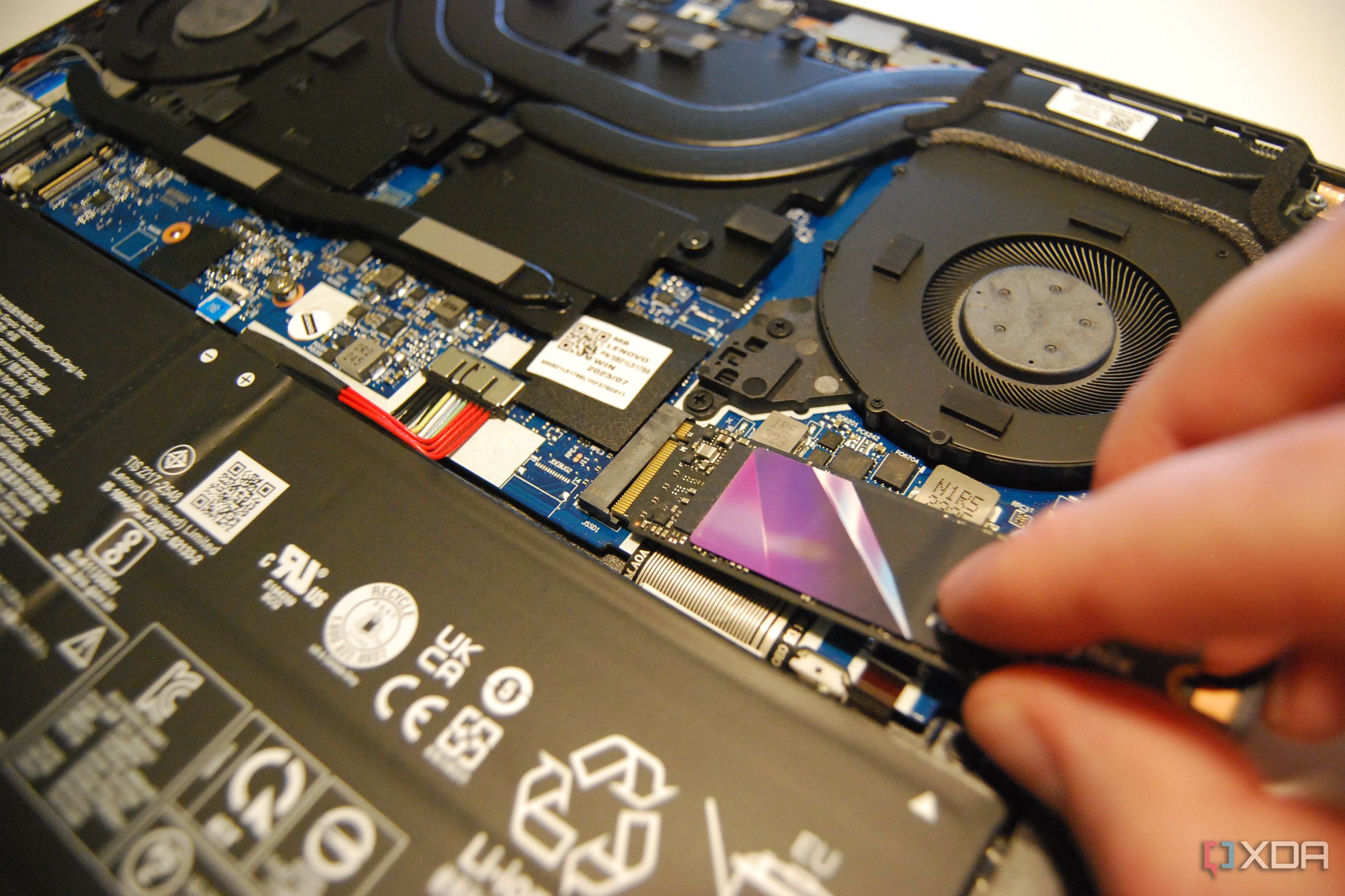 Slide the new SSD into the M.2 slot