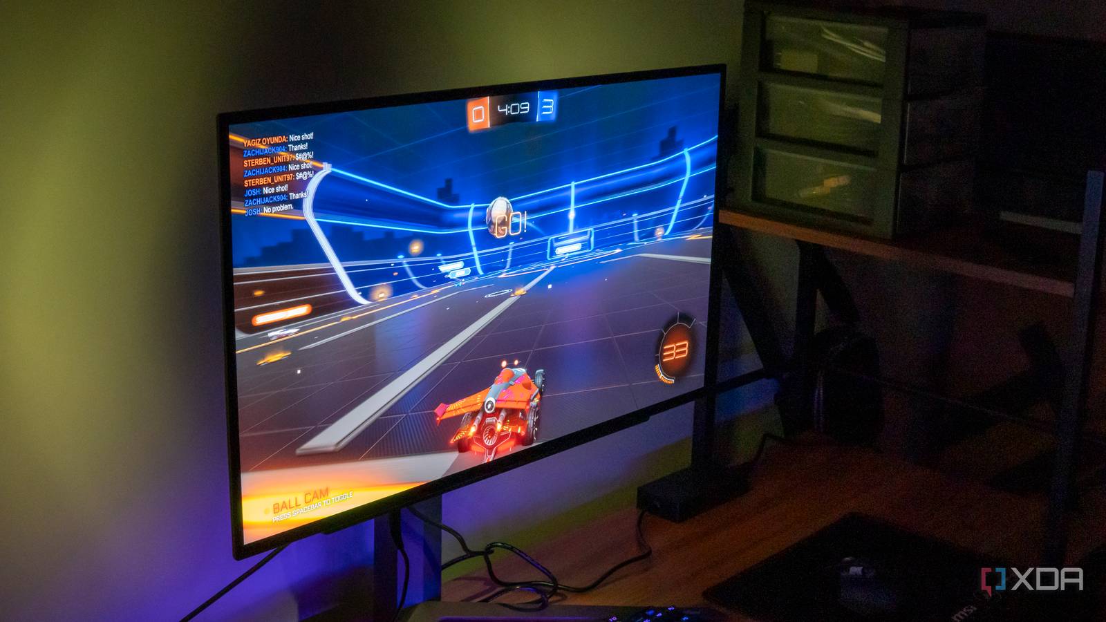 Left angled view of an LG UltraGear 27GR95QE monittor playing Rocket League