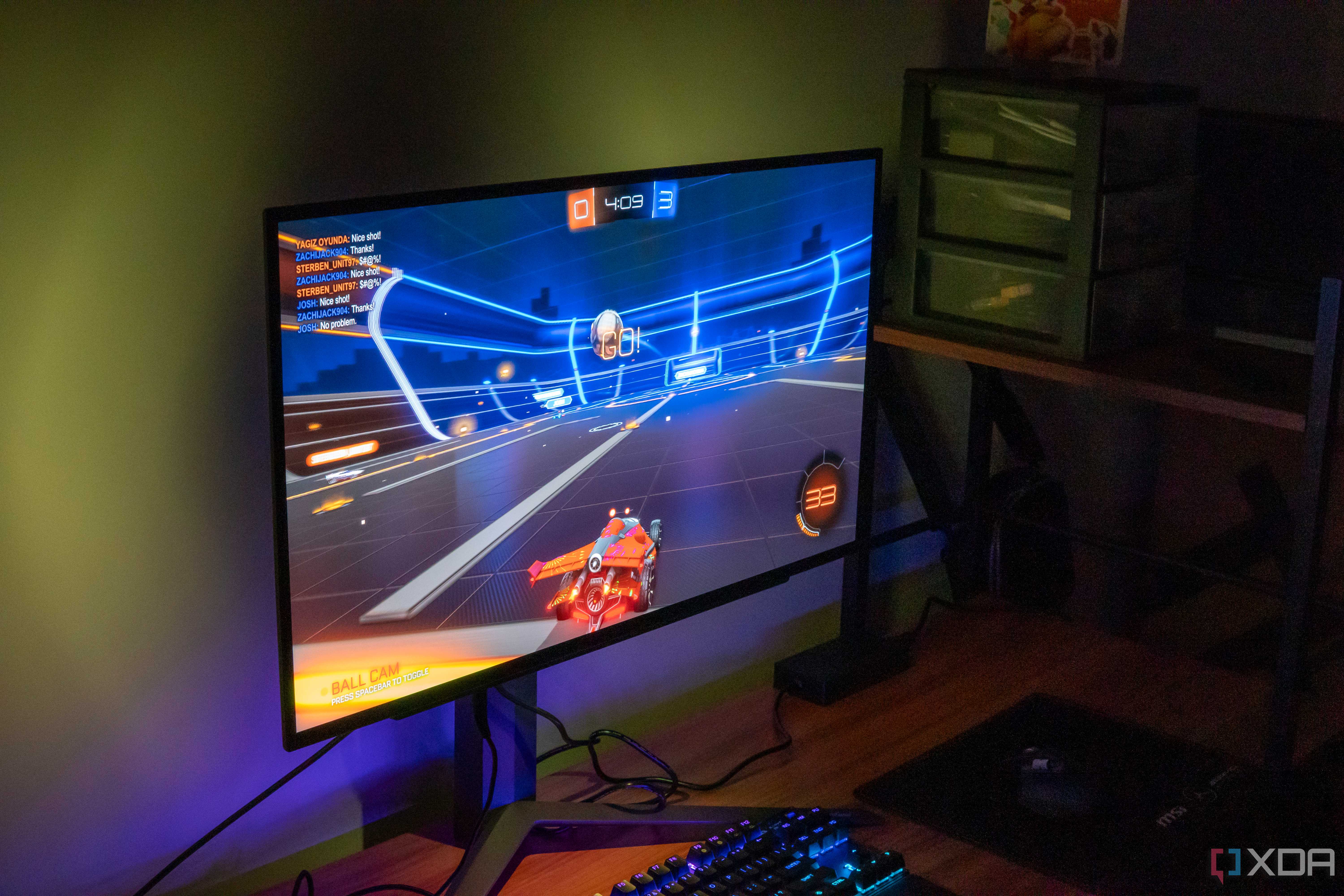 Left angled view of an LG UltraGear 27GR95QE monittor playing Rocket League