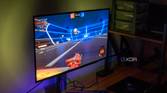 Left angled view of an LG UltraGear 27GR95QE monittor playing Rocket League