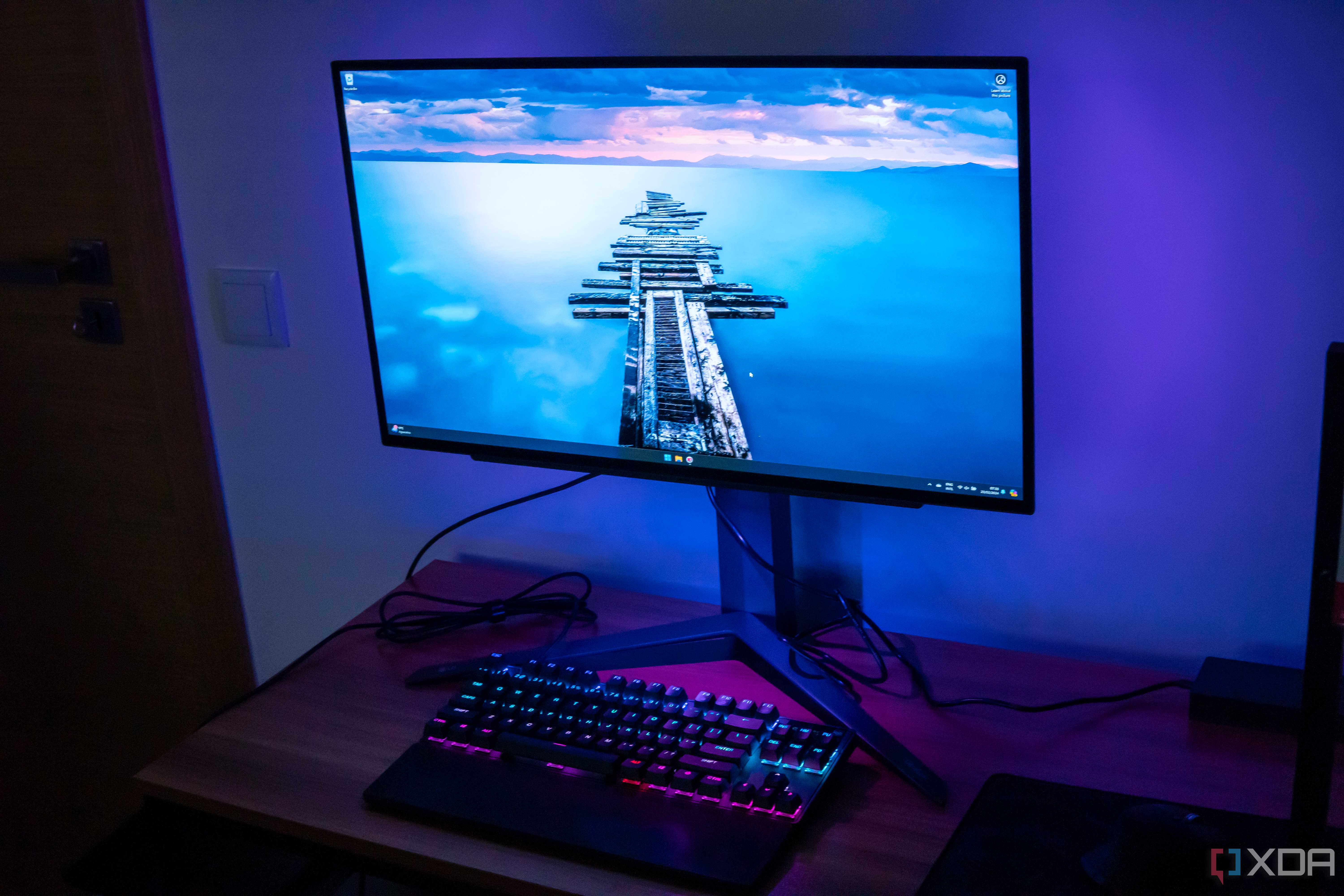 Right angled front view of the LG UltraGear 27GR95QE showing the desktop