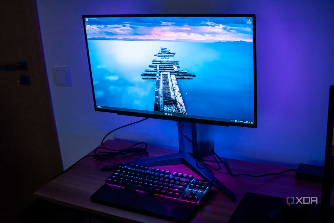 Right angled front view of the LG UltraGear 27GR95QE showing the desktop