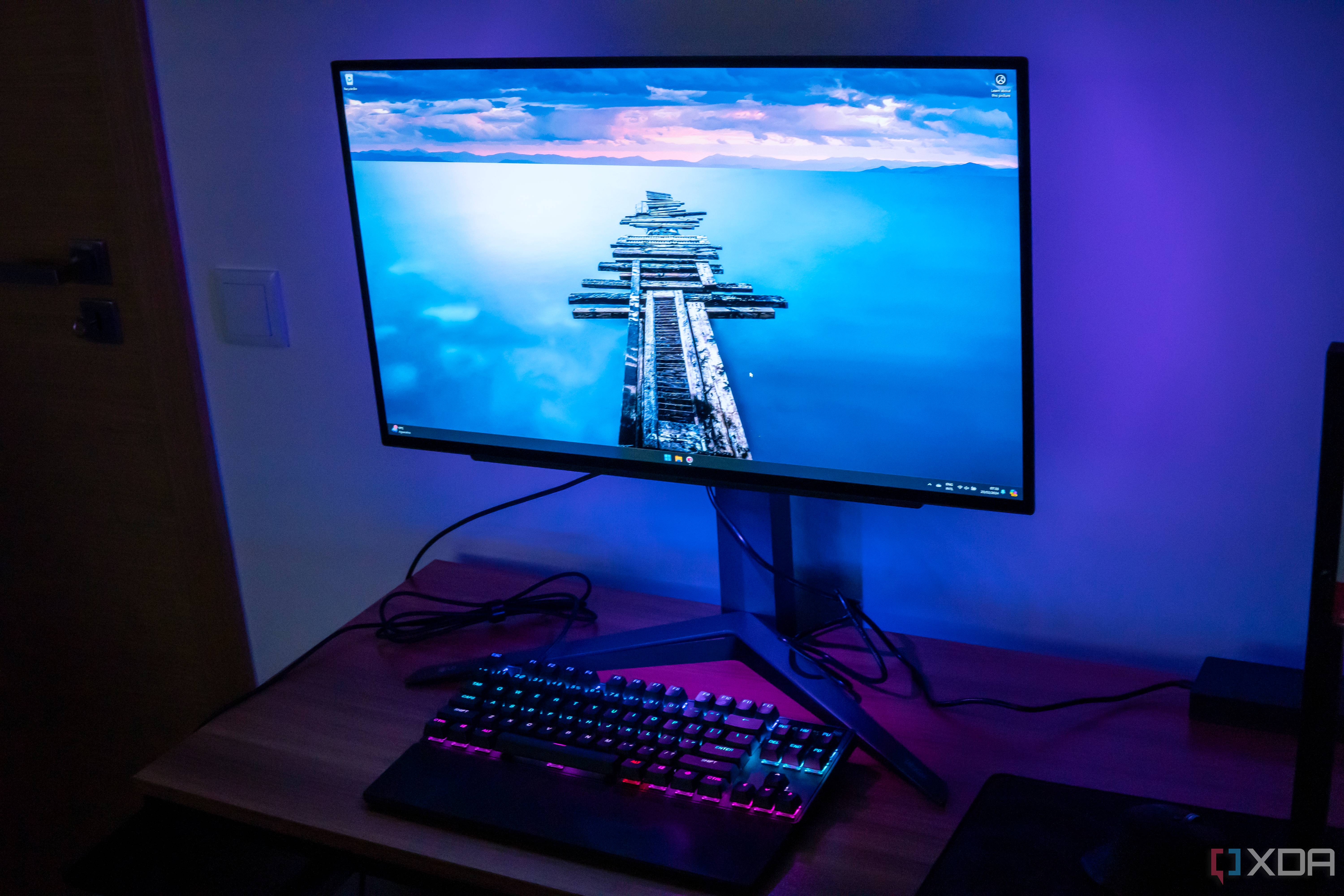 Right angled front view of the LG UltraGear 27GR95QE showing the desktop