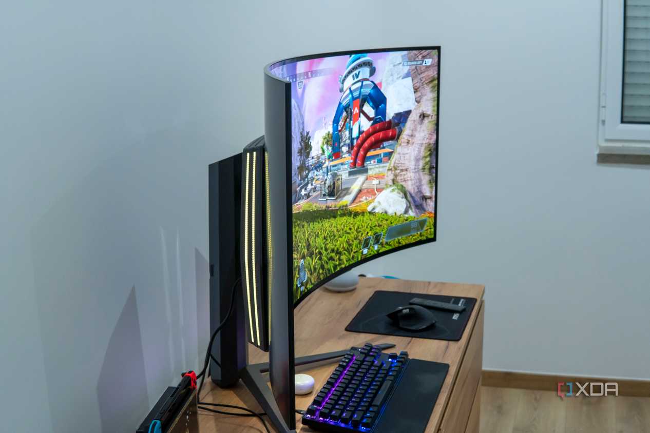 Side view of the LG UltraGear 45GR95QE with RGB lighting and running Apex Legends