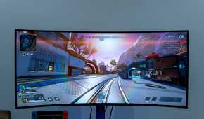 Front view of the LG UltraGear 45GR95QE displaying a bright scene in Apex Legends with the sun in front of the player