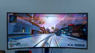 Front view of the LG UltraGear 45GR95QE displaying a bright scene in Apex Legends with the sun in front of the player