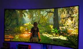 Angled front view of the LG UltraGear 45GR95QE monitor displaying Shadow of the Tomb Raider