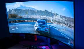 Angled view of the LG UltraGear 45GR95QE in a dark room with Forza Horizon 5 on the screen