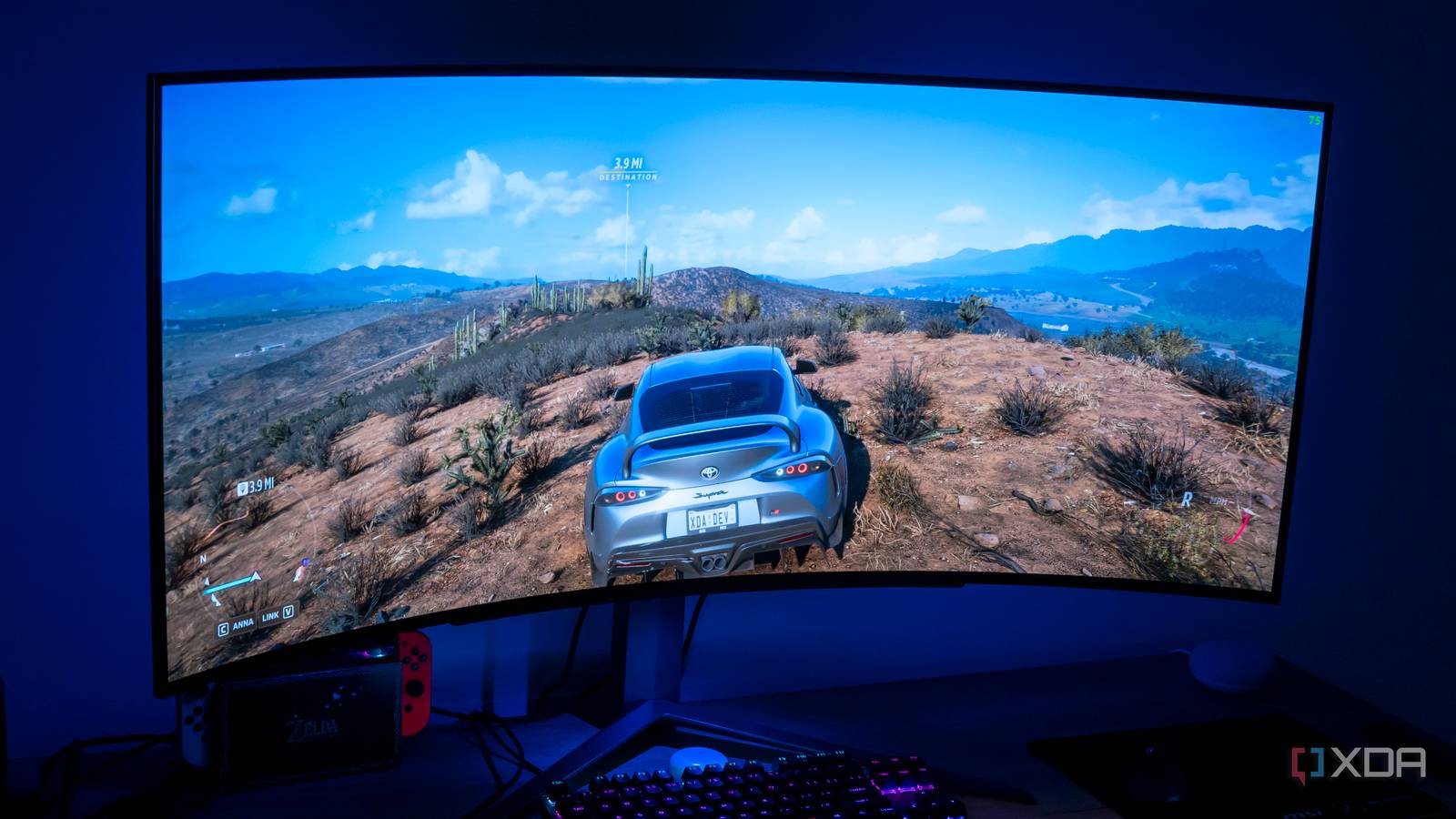 Angled front view of the LG UltraGear 45GR95QE displaying Forza Horizon 5