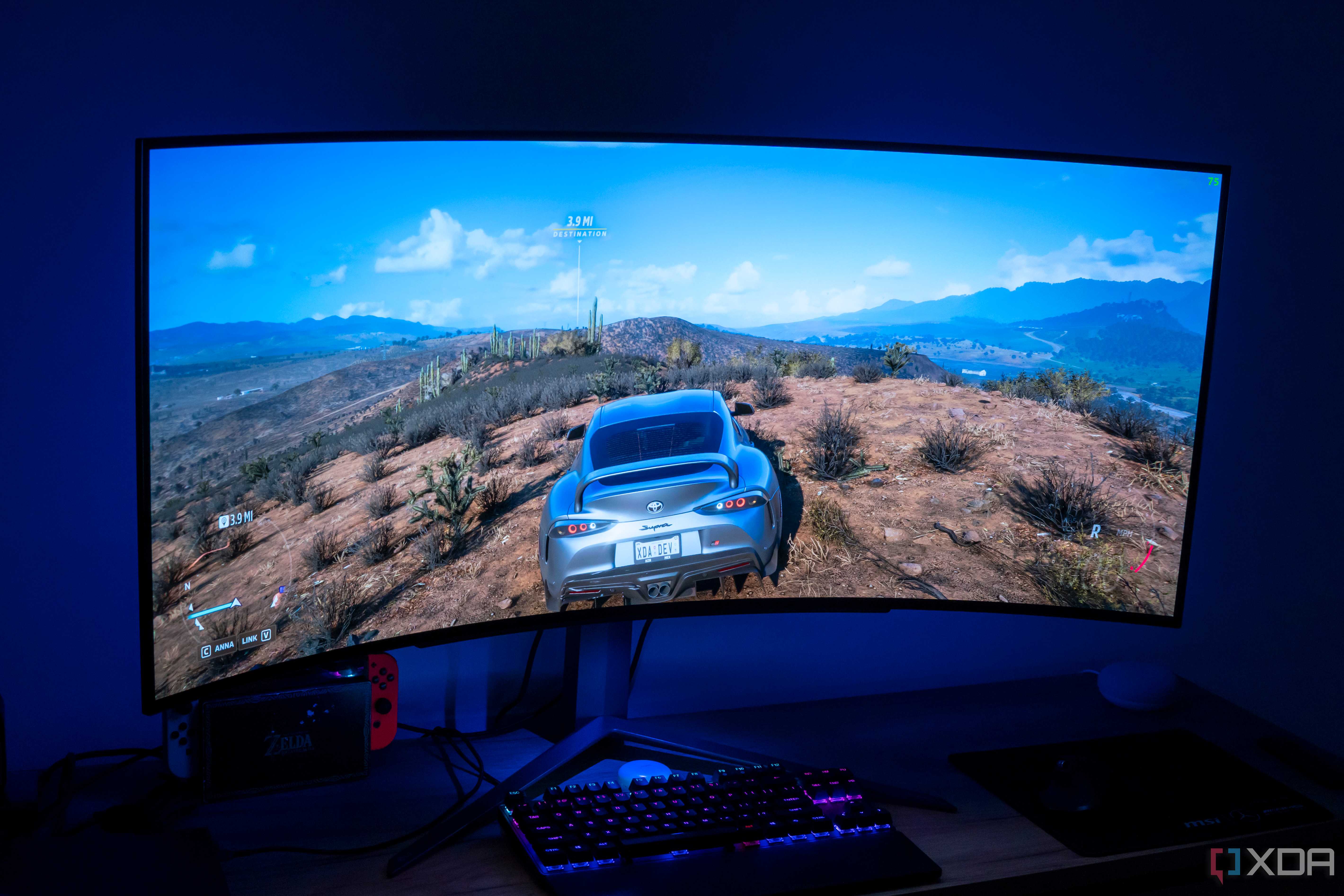 Angled front view of the LG UltraGear 45GR95QE displaying Forza Horizon 5