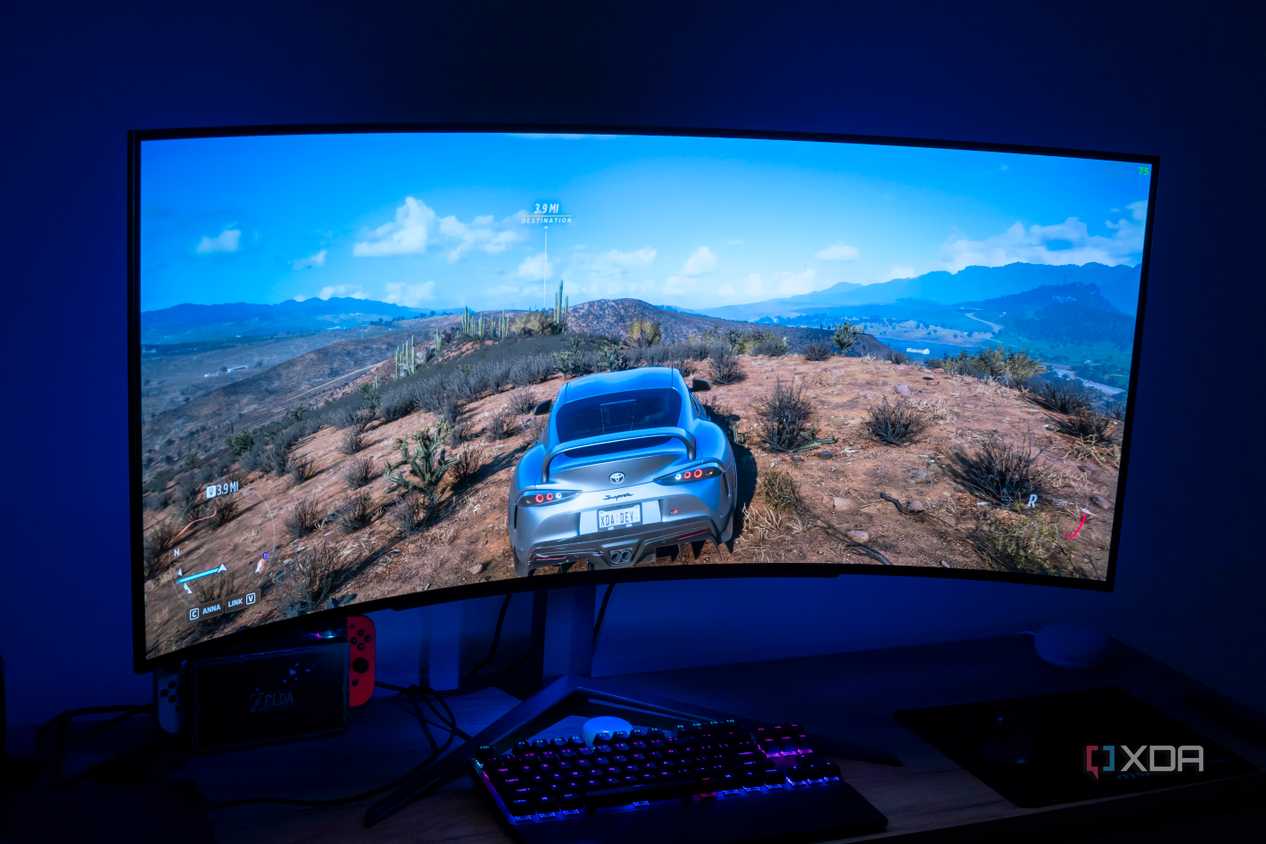 Angled front view of the LG UltraGear 45GR95QE displaying Forza Horizon 5