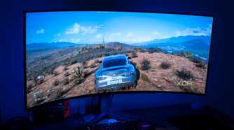 Angled front view of the LG UltraGear 45GR95QE displaying Forza Horizon 5