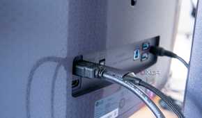 Close-up of the display inputs on the LG UltraGear 45GR95QE with HDMI and DisplayPort cables plugged in