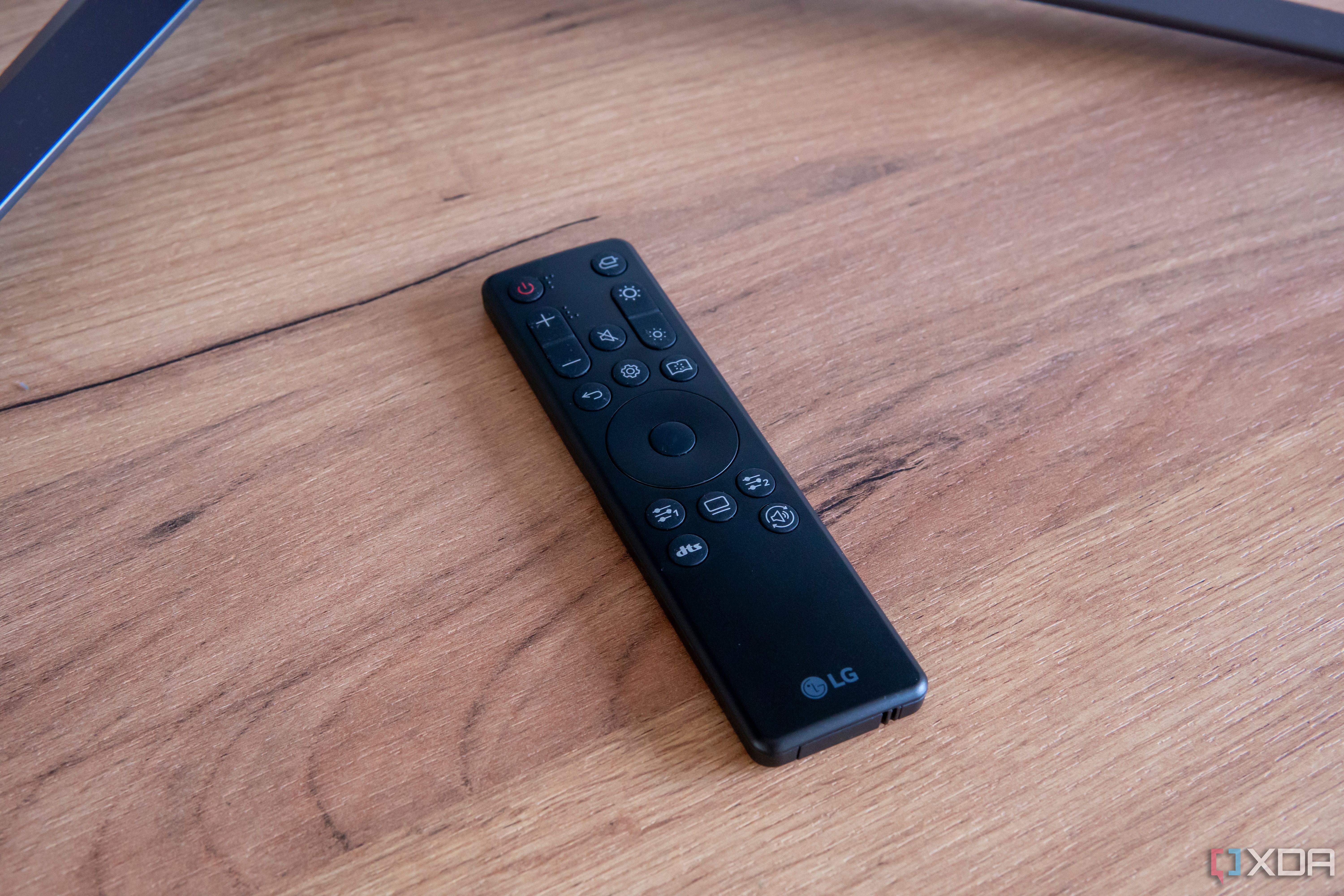 The remote controller included with the LG UltraGear 45GR95QE