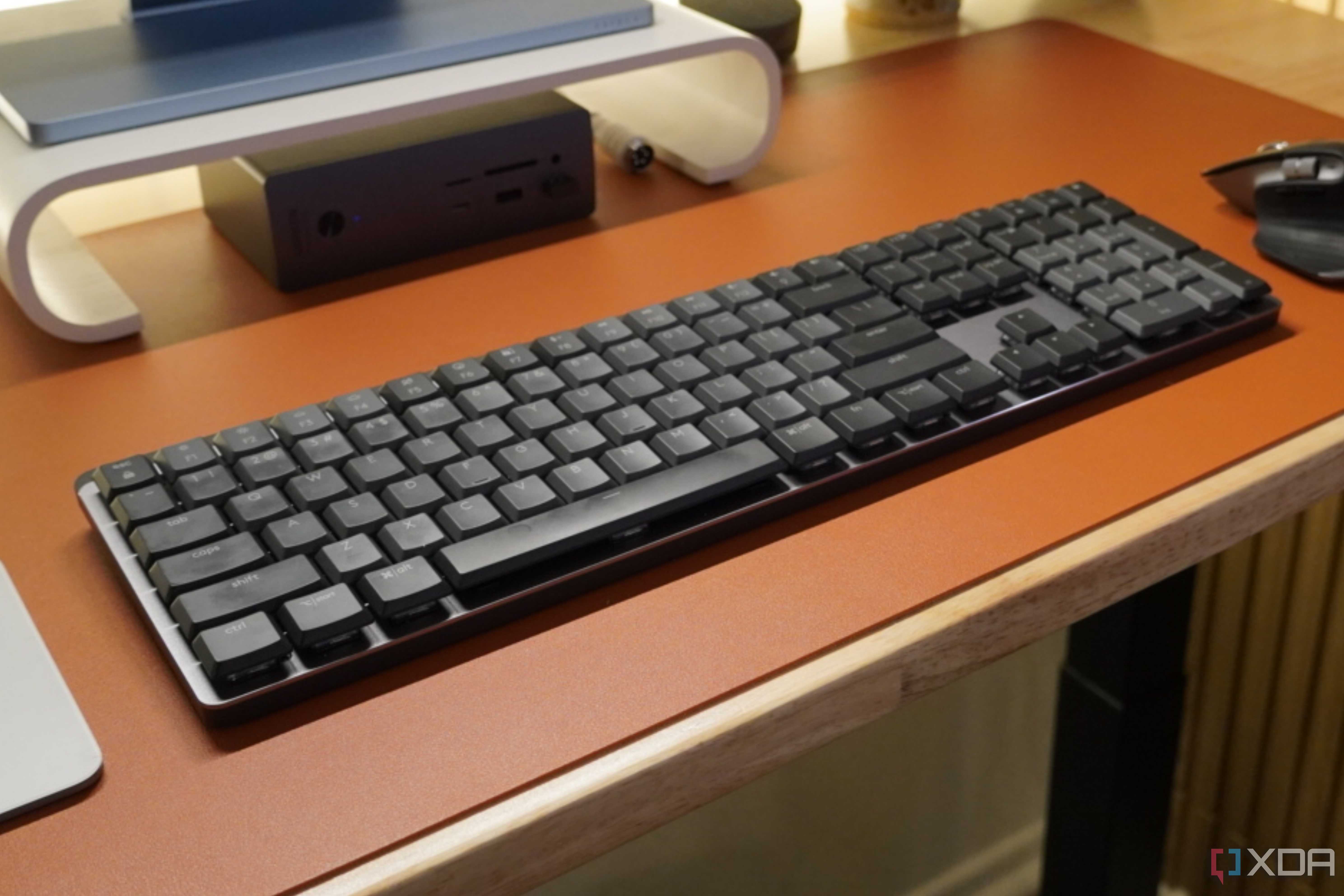 The Logitech MX Mechanical Keyboard as part of a desk setup.
