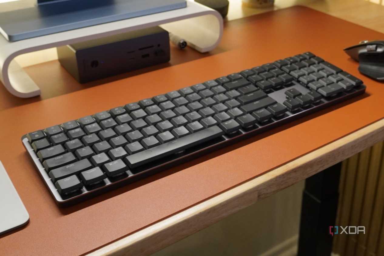 The Logitech MX Mechanical Keyboard as part of a desk setup.