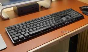 The Logitech MX Mechanical Keyboard as part of a desk setup.