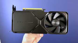 nvidia geforce rtx 4070 super founders edition held in front of blue wall