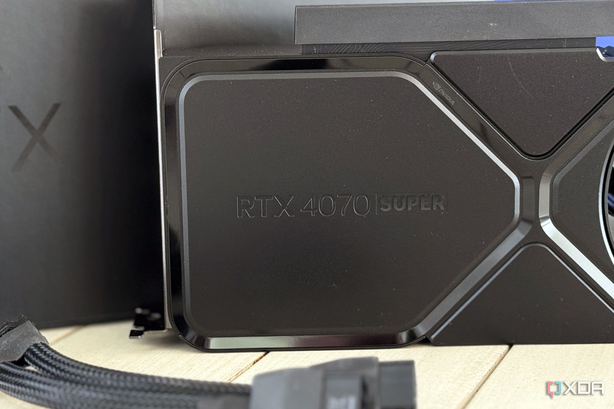 nvidia geforce rtx 4070 super founders edition logo panel with power adapter in front