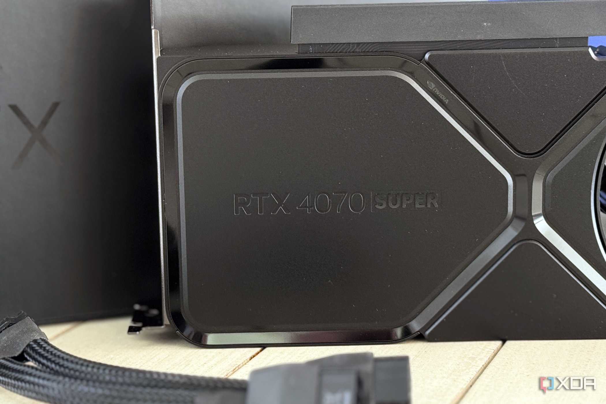 nvidia geforce rtx 4070 super founders edition logo panel with power adapter in front