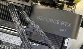 nvidia geforce rtx 4070 super founders edition installed on testbench showing power adapter