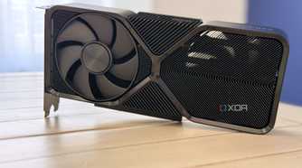 nvidia geforce rtx 4070 super founders edition stood up on table with light coming through the heatsink